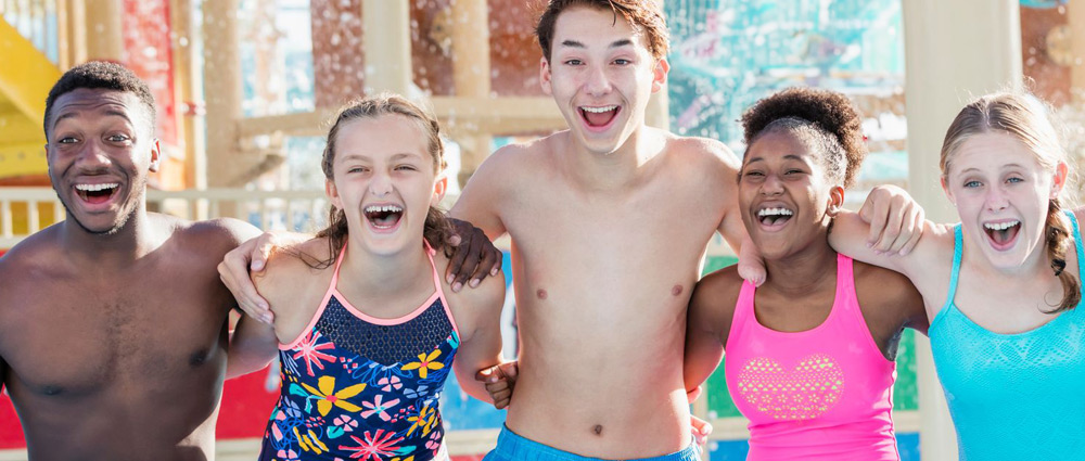 Group laughing in a pool