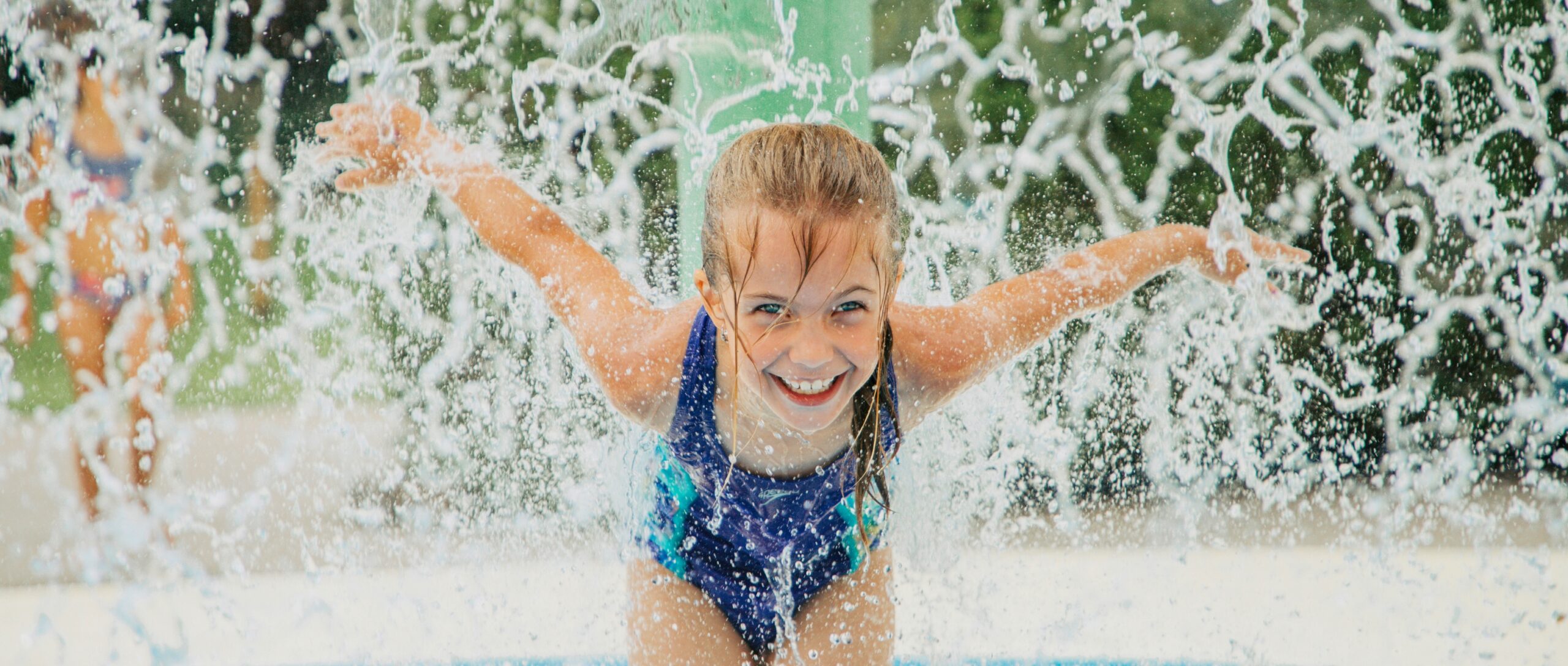 hawaiian-waters-girl-splashing-honolulu-bay Girl floating in a tube on the lazy river